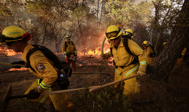 A Cal Fire Crew bugs out of a flare up on the Rocky Fire near Lower Lake  as they try to cut line around the perimeter of the fire, Wednesday July 29, 2015. (Kent Porter / Press Democrat) 2015