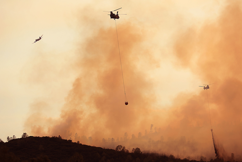 Chinook helicopters make drops on the Rocky fire, Thursday July 30, 2015. (Kent Porter / Press Democrat) 2015