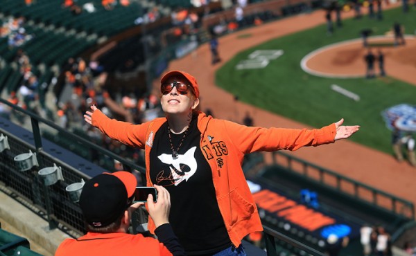 Ashley Brown of Concord is photographed by friend Paul Bryson of San Francisco prior to the Giants opening day against the Dodgers at AT&T Park in San Francisco, Thursday April April 7, 2016. (Kent Porter / Press Democrat ) 2016