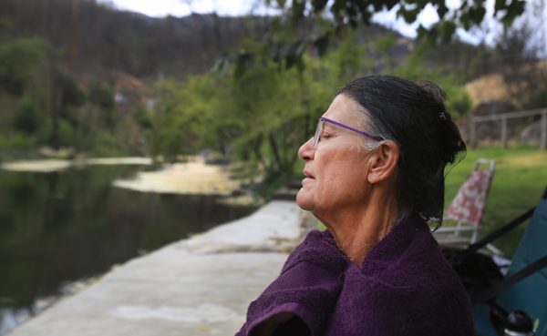 Margit Pataki meditates after taking a swim in Anderson Springs Monday Aug. 29. A resident of Rose Anderson Road in the the community of Anderson Springs, Pataki lost her home of 20 years to the the 2015 Valley fire. (Kent Porter / The Press Democrat) 2016