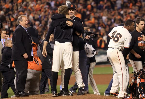 Hunter Pence and Bruce Bochy embrace after the Giants beat the Nationals to move to the NLCS, Tuesday Oct. 7, 2014 during game 4 of the NLDS at AT&T Park in San Francisco. (Kent Porter / Press Democrat) 2014