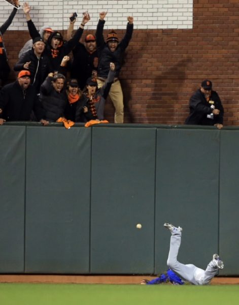 Chicago's Albert Almora Jr. fails to catch a triple by Conor Gillaspie which scored two runs in the eighth inning of Game 3 during the NLDS at AT&T Park in San Francisco, Monday, Oct. 10, 2016.
