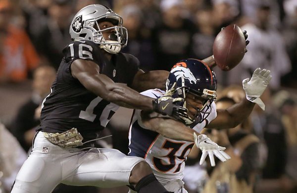 Tauren Nixon of the Broncos interferes with Johnny Holton on a series of plays where Denver was called for three pass interference calls that led to an Oakland TD, Sunday Nov. 6, 2016 in Oakland.