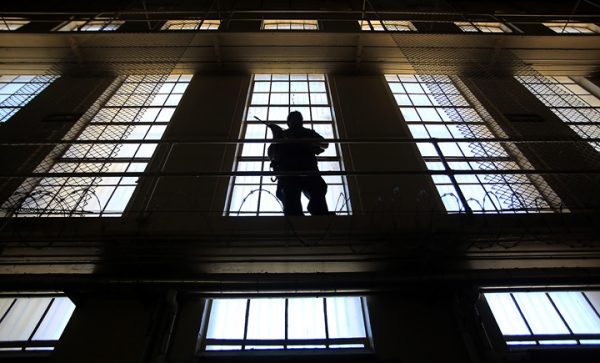 A guard with rifle, watches over San Quentin's Death Row, Tuesday August 16, 2016. (Kent Porter / The Press Democrat) 2016