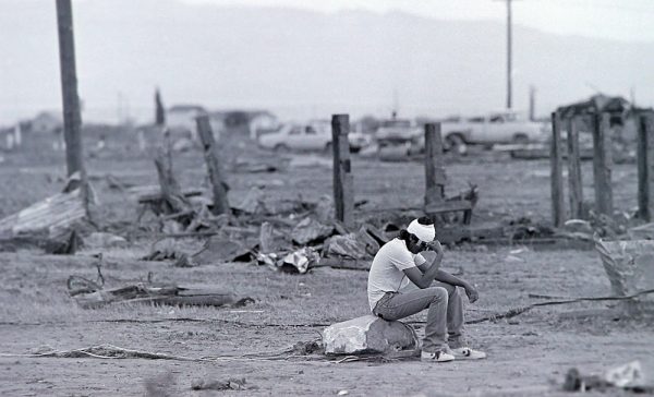 The morning after the tornado, families began to find their loved ones as the walked the path of the tornado. 121 people were injured. (©Kent Porter) 