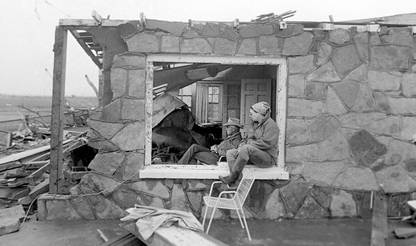 Peggy and Bob Walker sit in stunned silence May 23, 1987, the morning after Saragosa, Texas was hit by an EF4 tornado, killing 30 people. (© Kent Porter) 