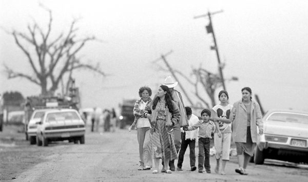 A Saragosa family takes a trek to view tornado damage on County Ranch Road 1215. (©Kent Porter)